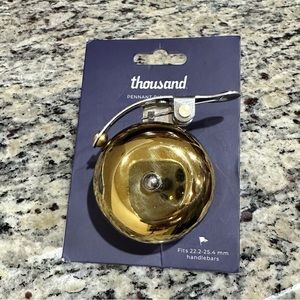 NWT Thousand Pennant Bicycle Bell ring. Color Brass